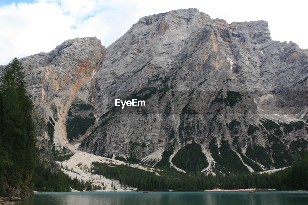 Scenic view of lake and mountains against sky