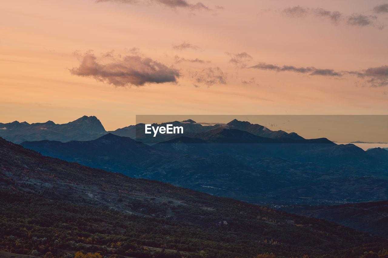 Scenic view of mountains at sunset in autumn