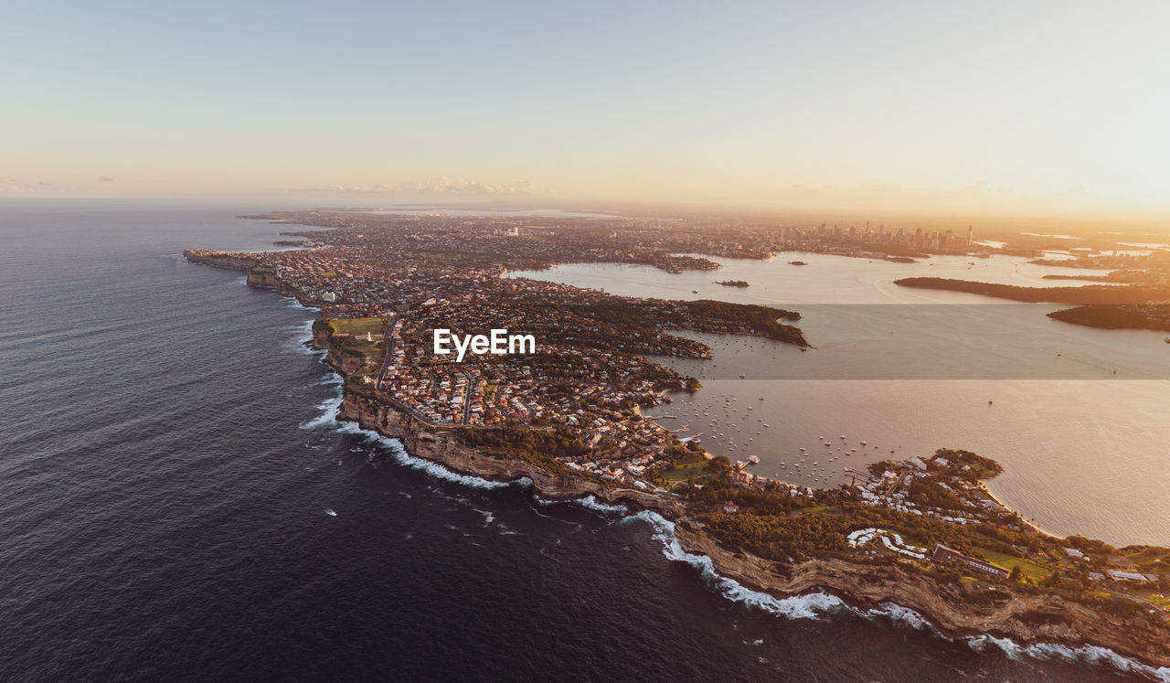 Drone view of south head, watsons bay with sydney harbour, cbd and harbour bridge in the background