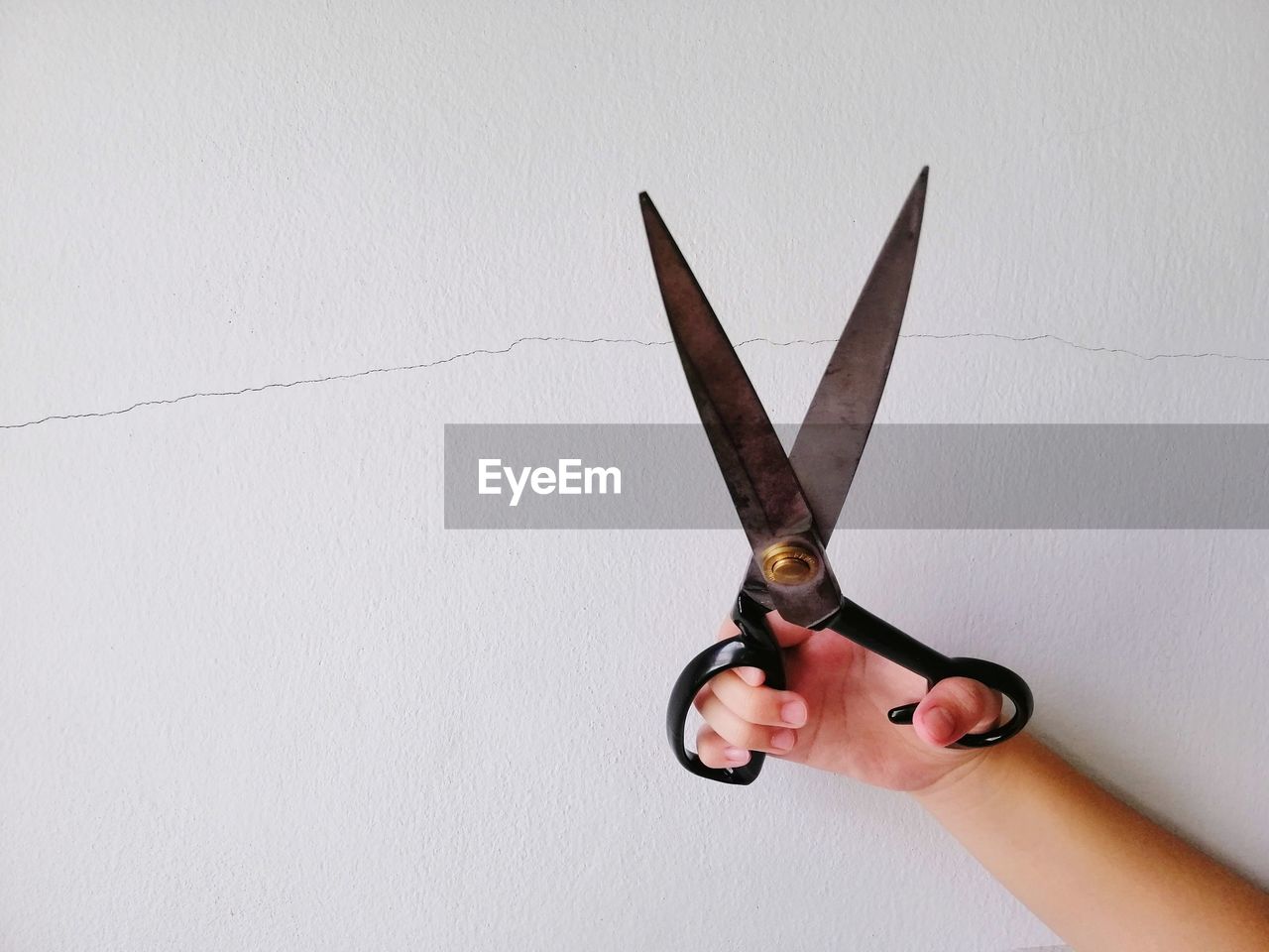 LOW ANGLE VIEW OF HAND AGAINST WHITE BACKGROUND