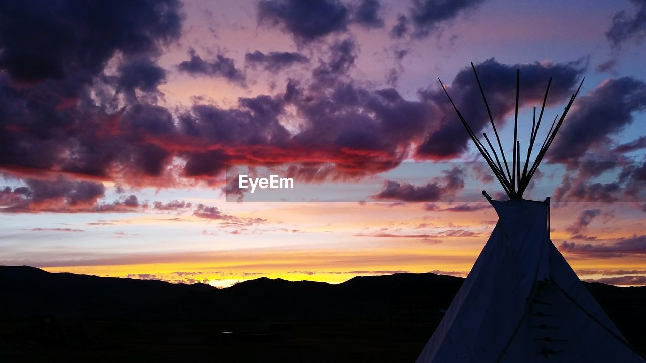 Low angle view of silhouette mountain against sky during sunset