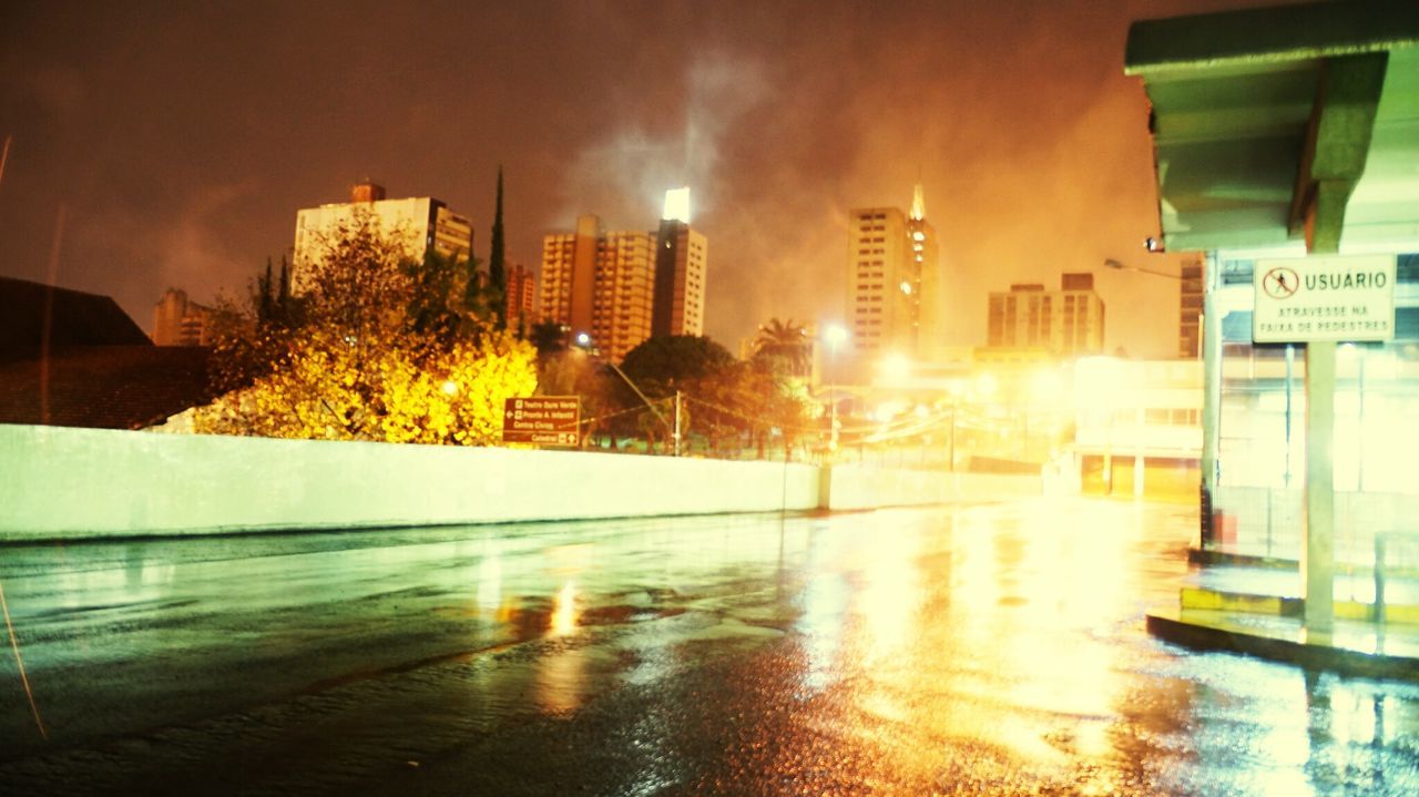 VIEW OF ILLUMINATED BUILDINGS IN CITY