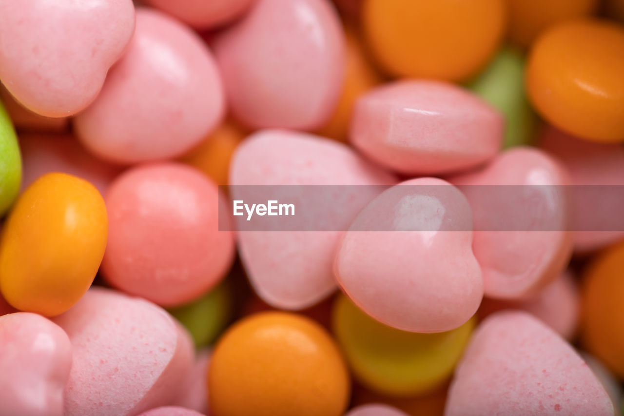 Close-up colored heart candy for the background. colorful candies brightly textured