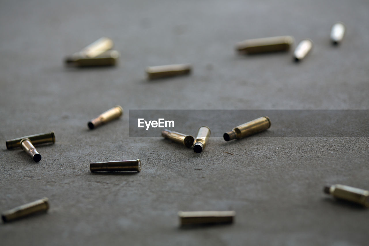 Close-up of bullets on floor