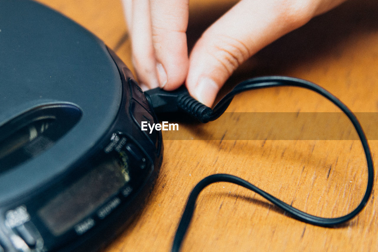 High angle view of person using audio equipment on table