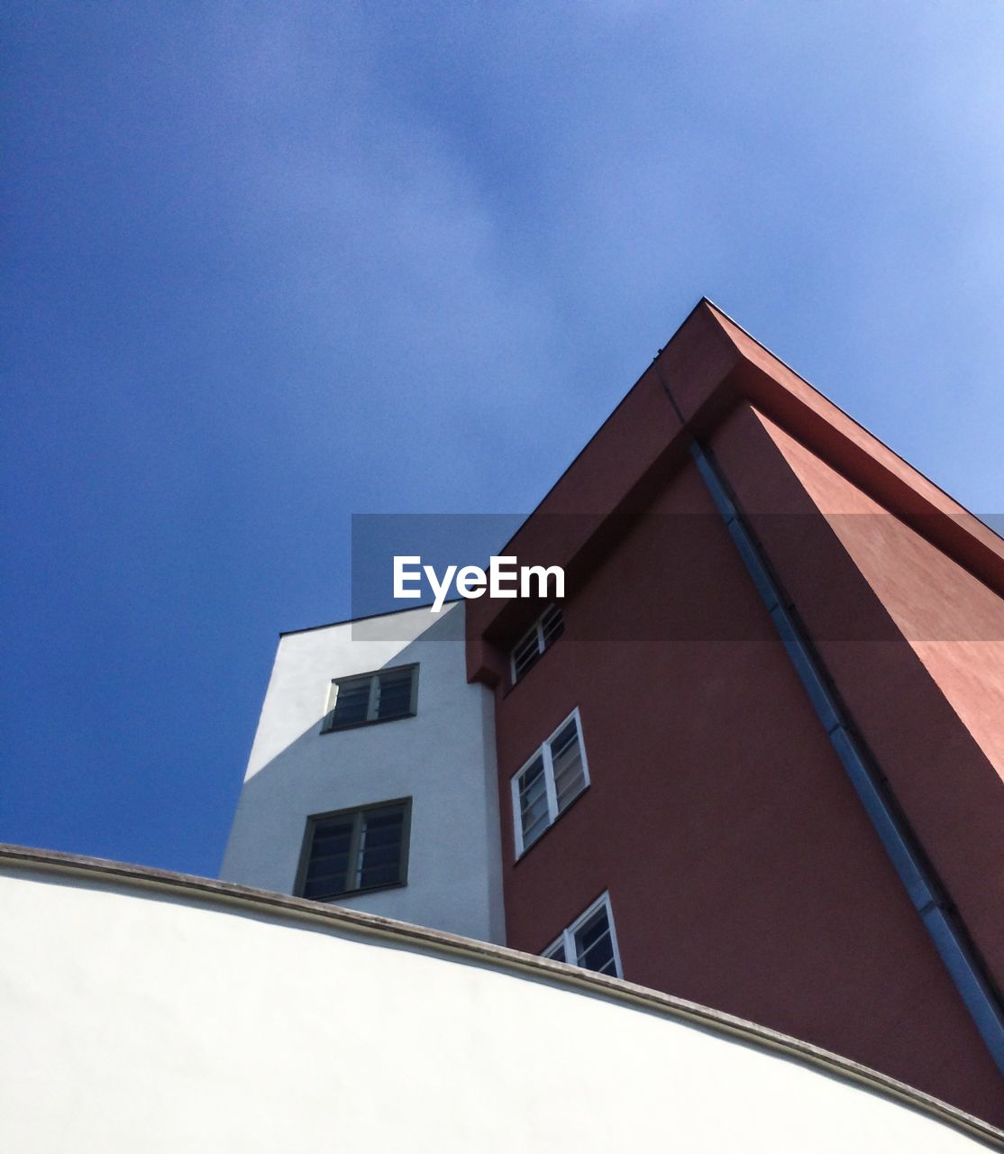 Low angle view of building against blue sky