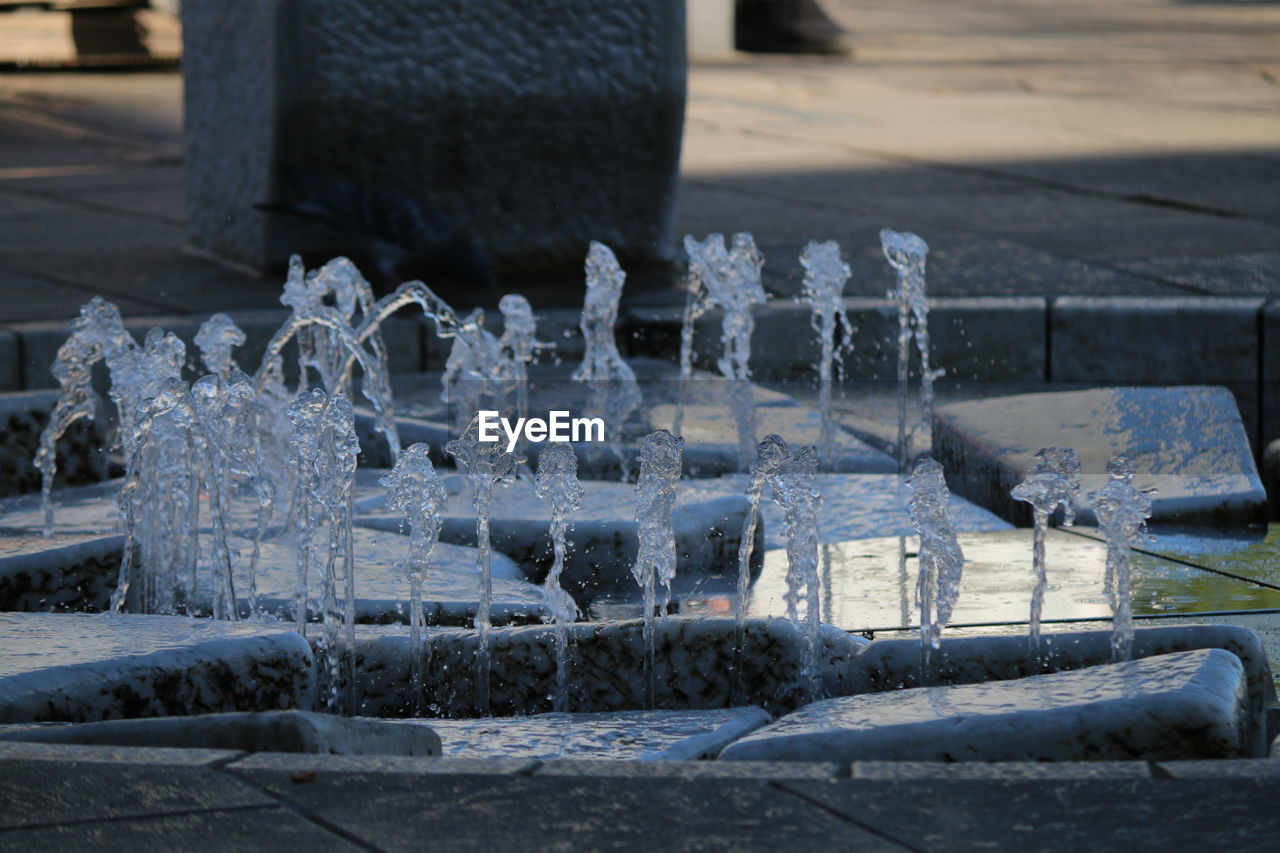 CLOSE-UP OF ICE ON TABLE AGAINST FROZEN BACKGROUND