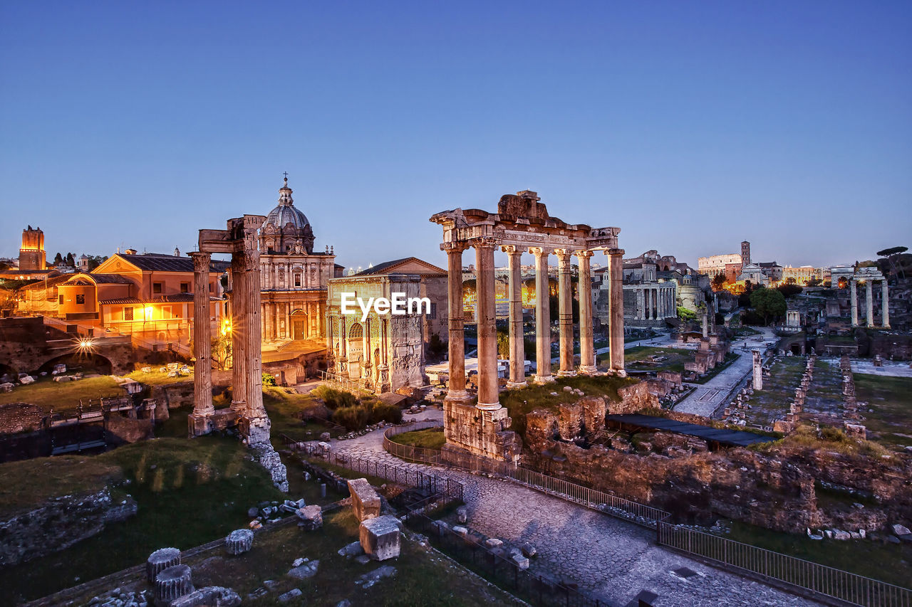 High angle view of roman forum against sky at sunset