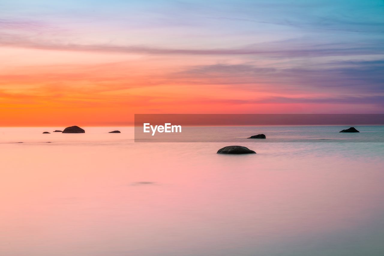 Scenic view of sea against sky during sunset