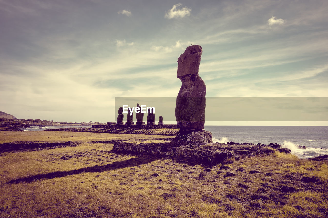 VIEW OF ROCKS ON SHORE AGAINST SKY