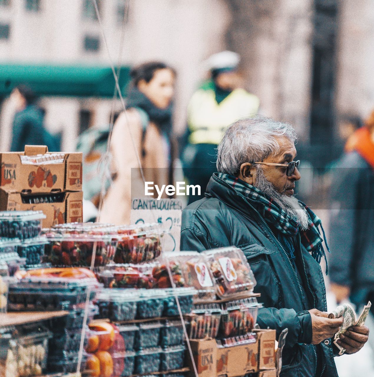 PEOPLE AT MARKET STALL