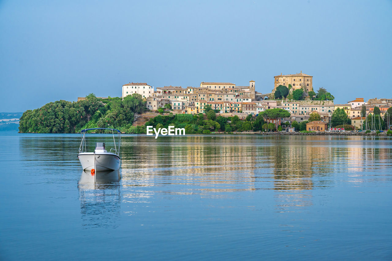 Townscape of capodimonte, ancient village on a promontory on the bolsena lake, lazio, italy