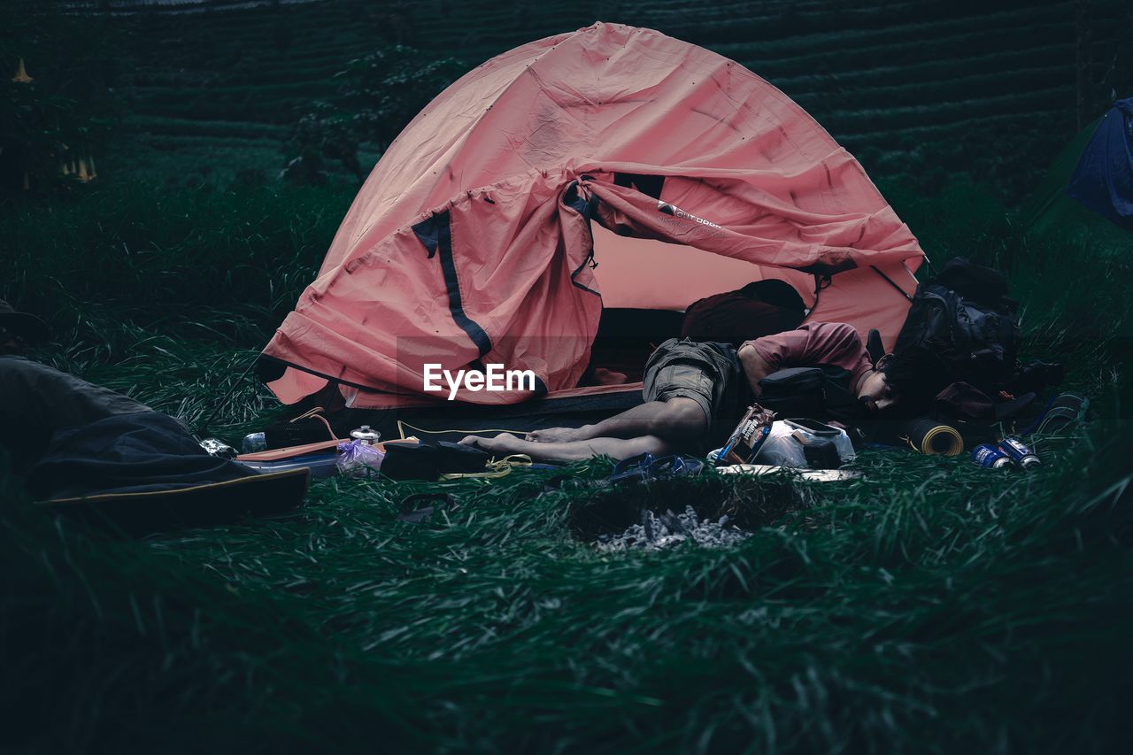 PEOPLE RELAXING IN FIELD