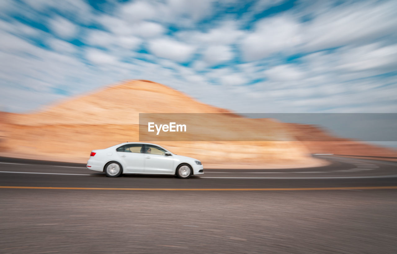 CAR MOVING ON ROAD