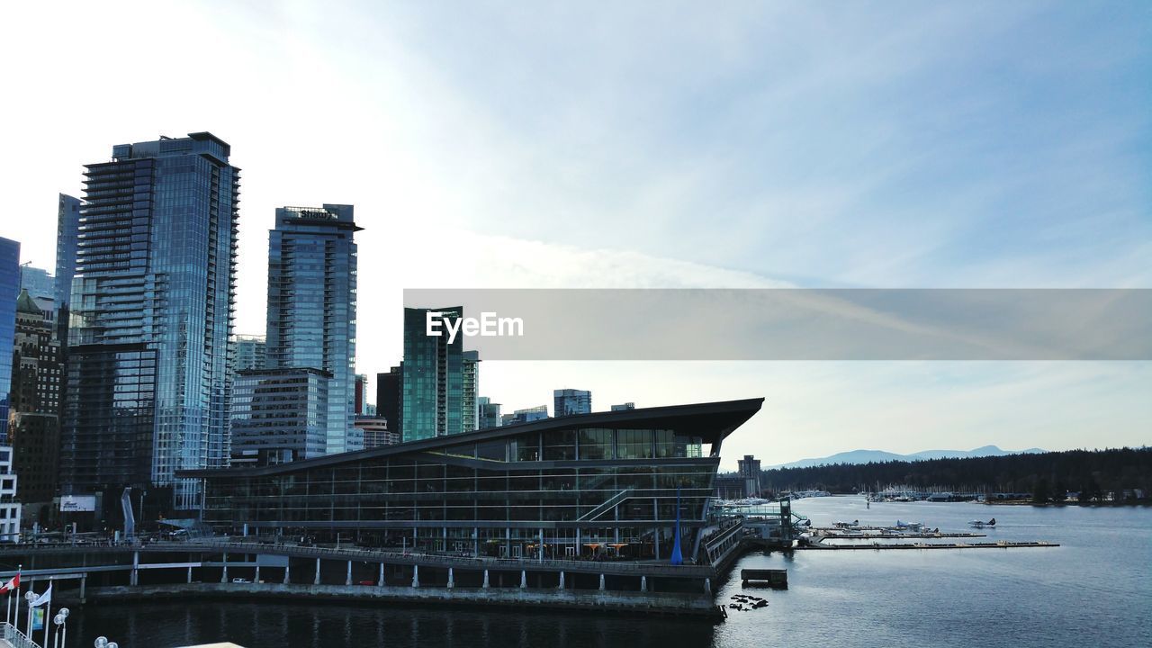 Low angle view of skyscrapers at seaside