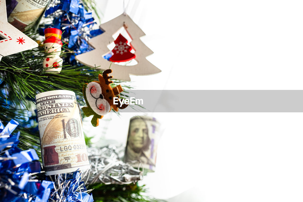 CLOSE-UP OF CHRISTMAS DECORATIONS ON WHITE BACKGROUND