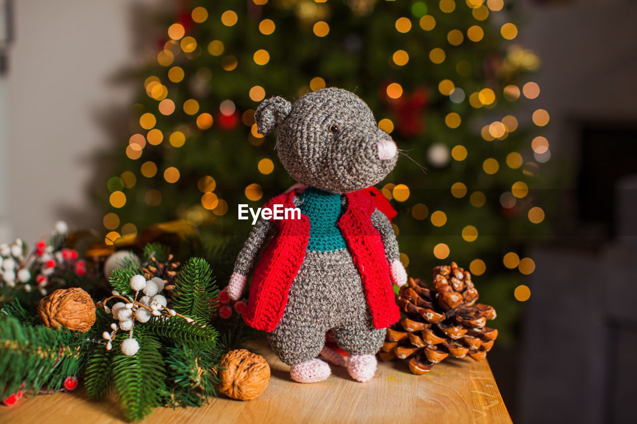 VIEW OF CHRISTMAS TREE WITH TOY IN CITY