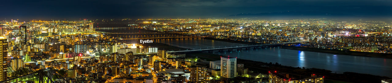 High angle view of illuminated city buildings at night