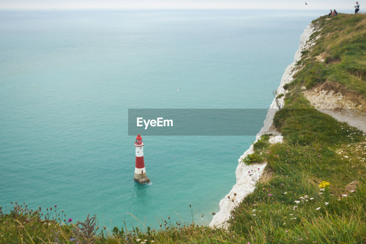 White chalk headland cliffs and beachy head lighthouse. seven sisters, east sussex, uk.