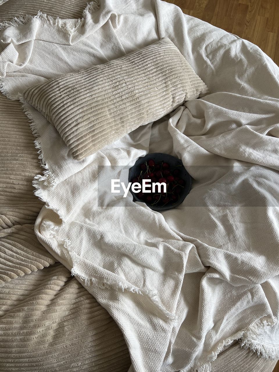white, indoors, textile, high angle view, bed, furniture, linen, food and drink, crumpled, clothing, food, black, no people, directly above, art, sheet