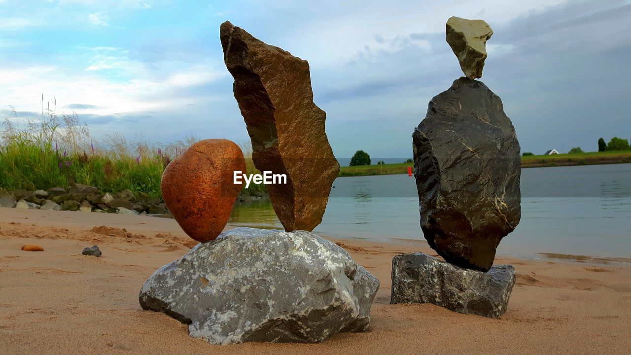 STACK OF ROCKS ON SHORE