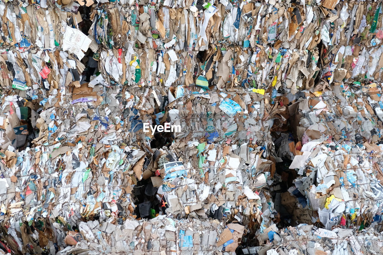 FULL FRAME SHOT OF GARBAGE ON TABLE