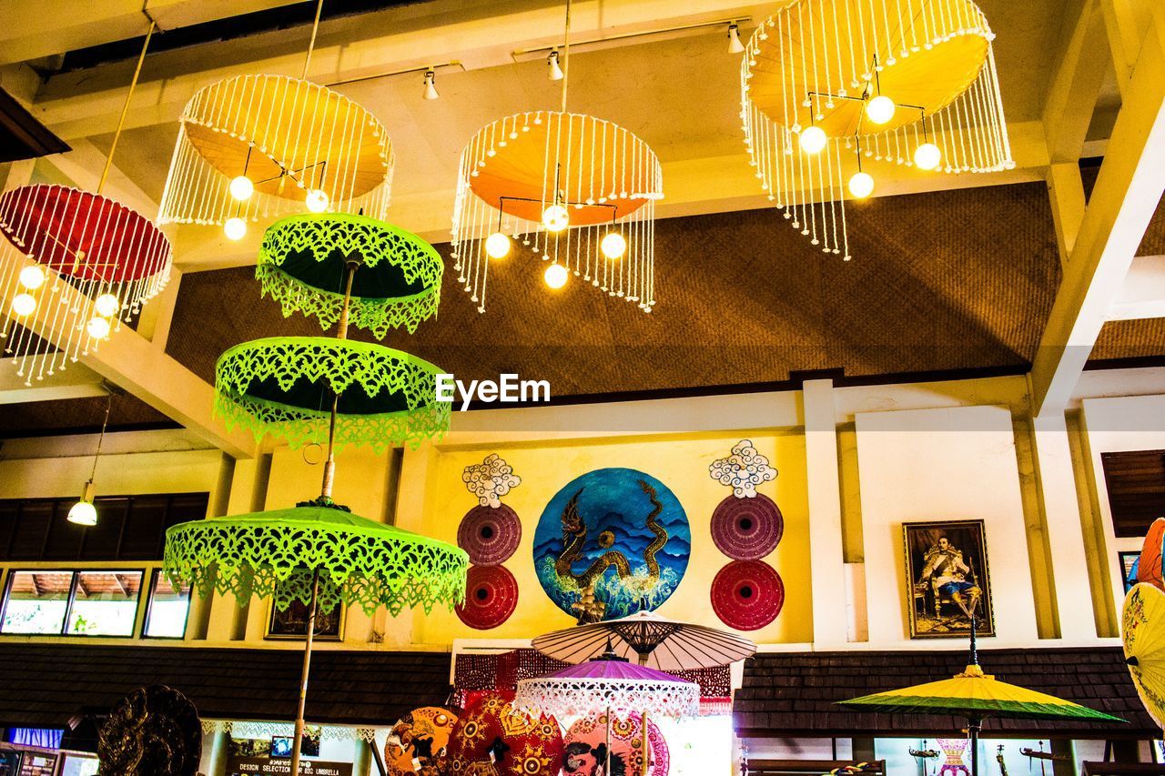 MULTI COLORED DECORATIONS HANGING IN KITCHEN