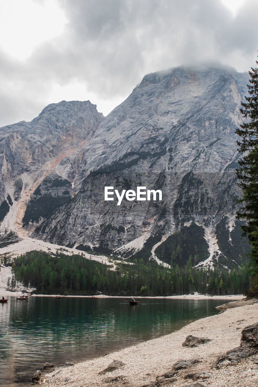 Scenic view of lake and mountains against sky