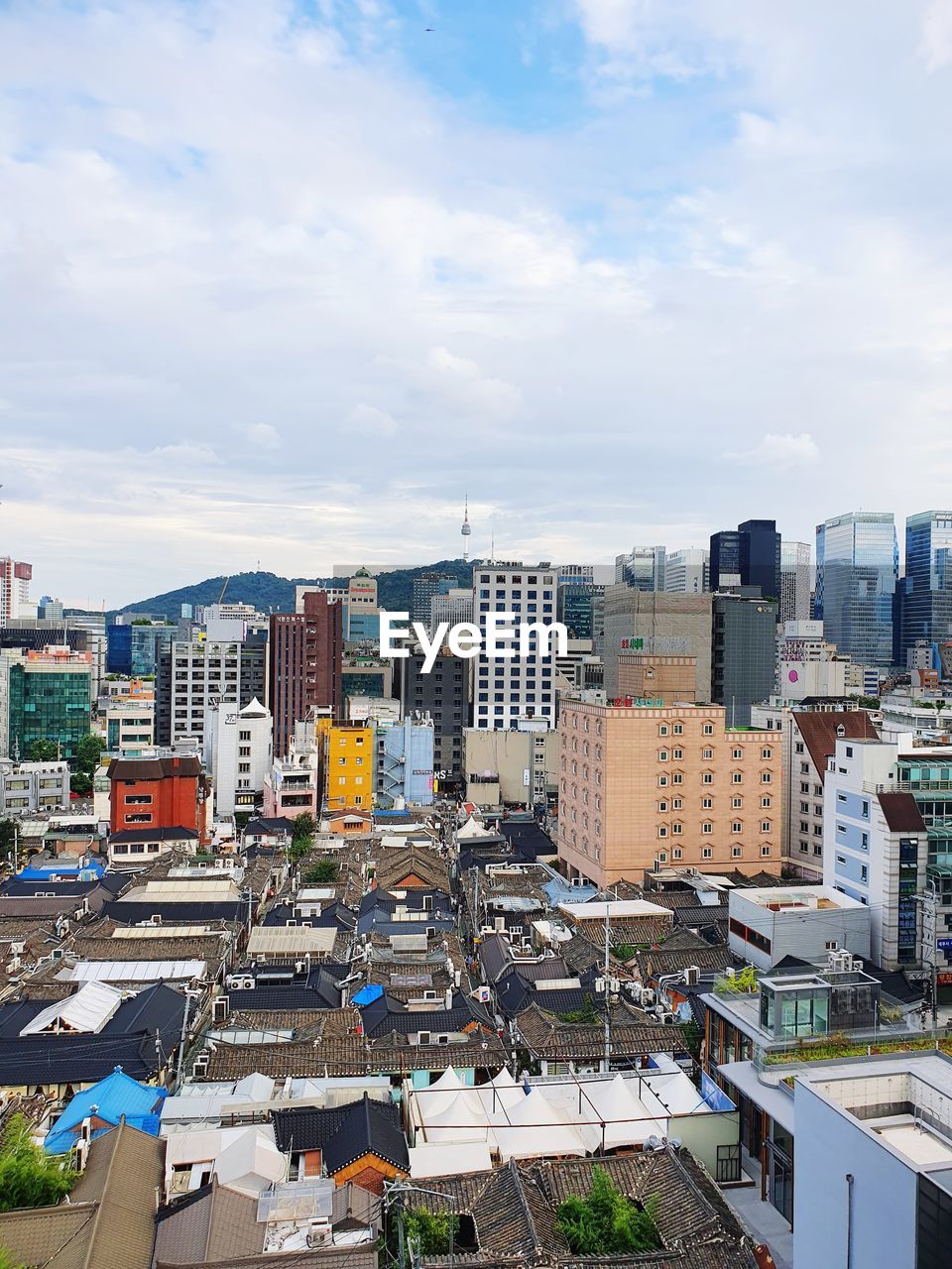 high angle view of buildings in city against sky