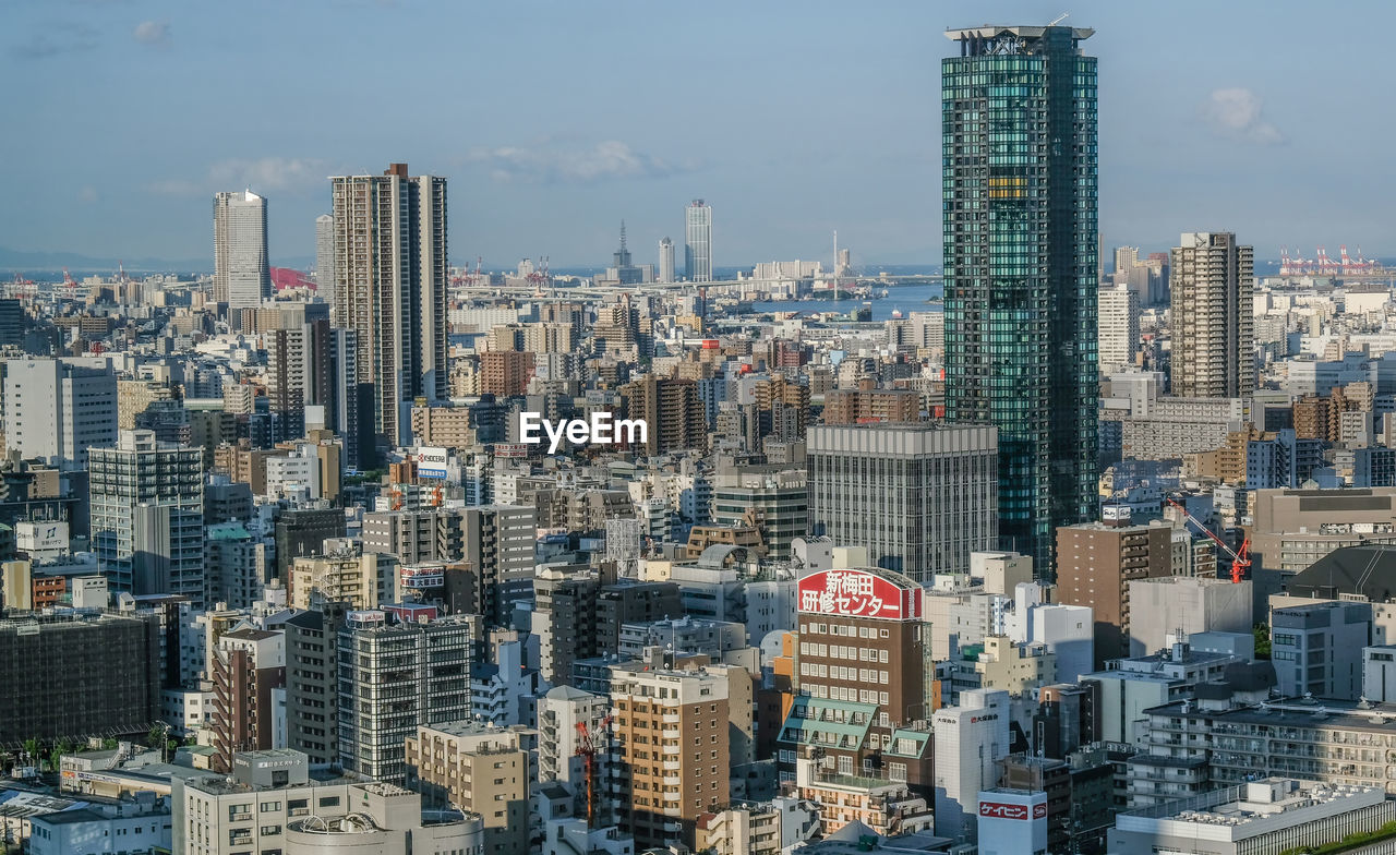 High angle shot of cityscape against the sky