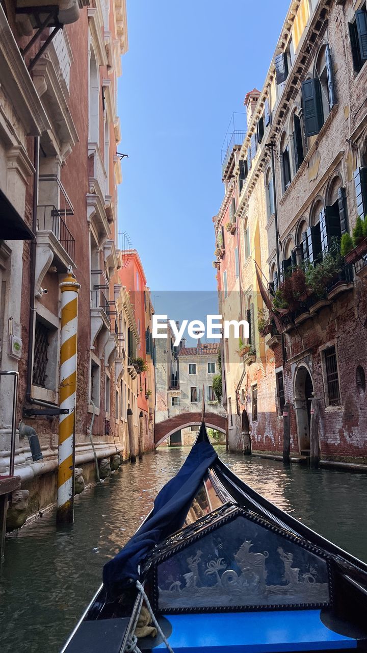 Venice, italy, venetian canals.  gondola with tourists float along the canals of venice.