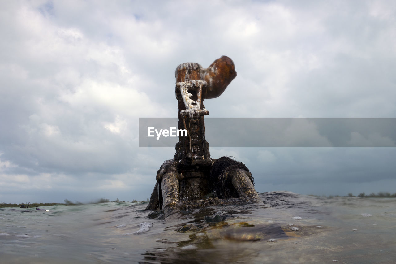 sea, cloud, water, sky, statue, coast, ocean, nature, sculpture, rock, no people, wave, day, shore, land, outdoors, beach, animal, sand, overcast, animal themes, environment, body of water