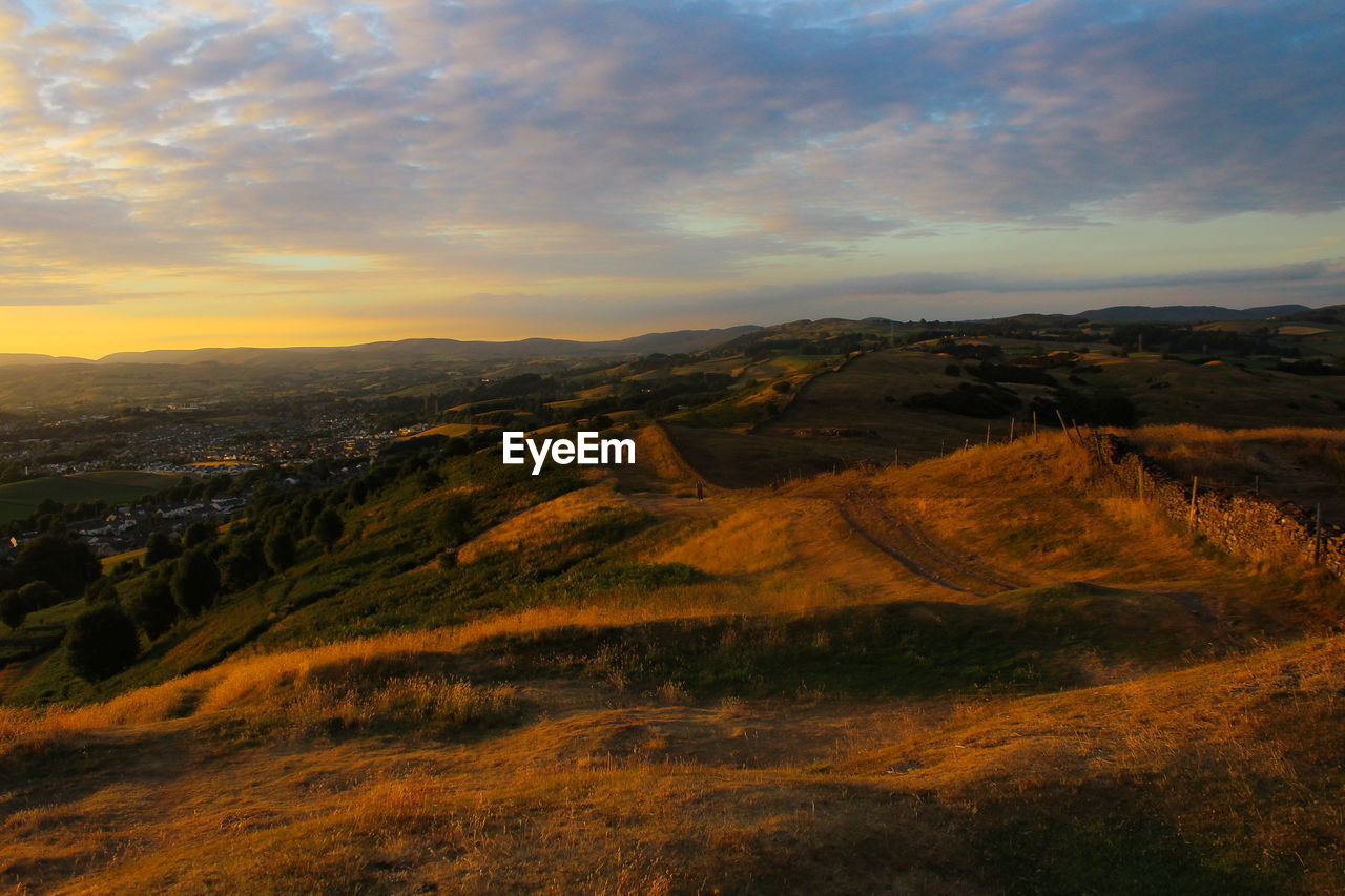 Scenic view of landscape against sky during sunset