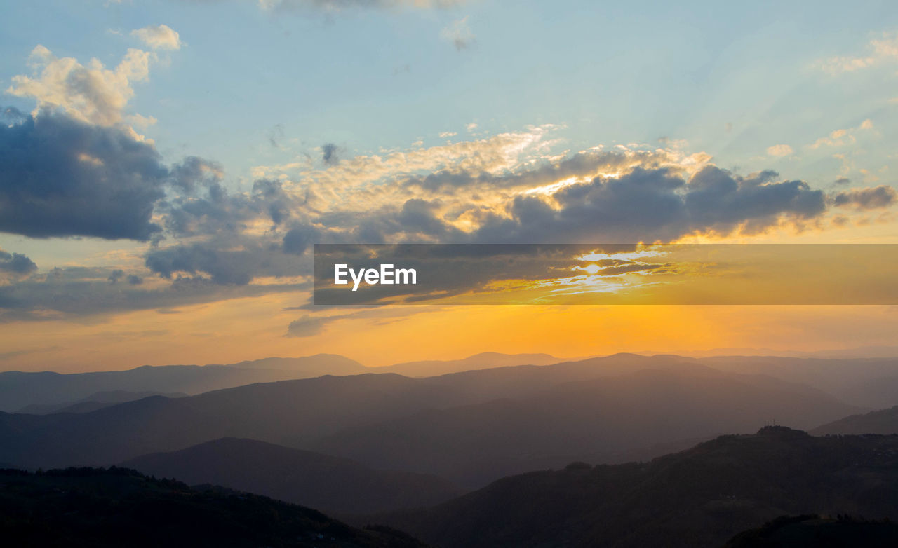 Scenic view of dramatic sky during sunset