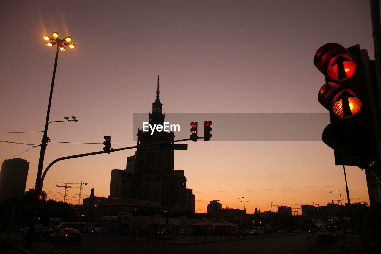 Palace of culture and science against clear sky at sunset