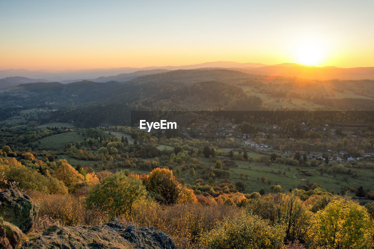 SCENIC VIEW OF LAND AGAINST SKY DURING SUNSET