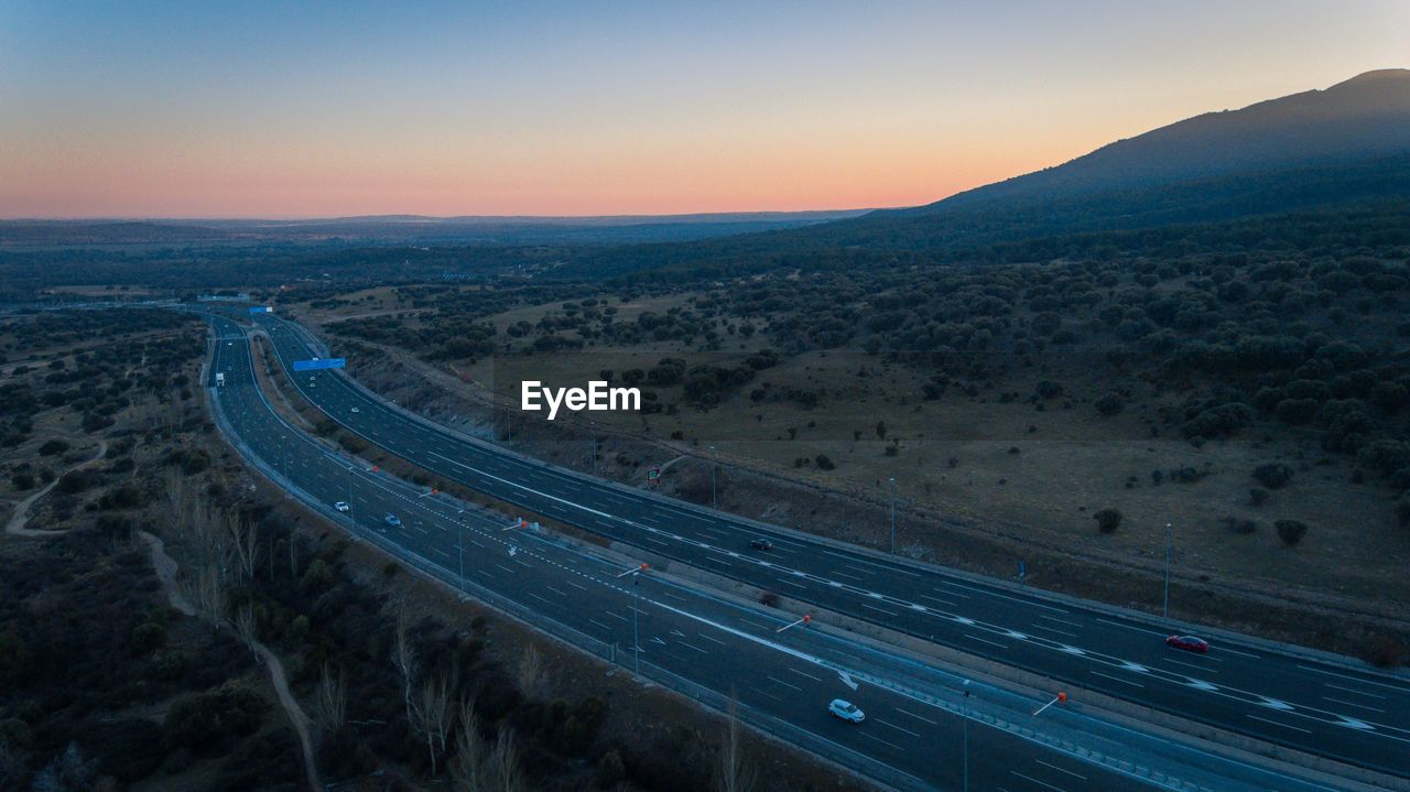 High angle view of highway against sky during sunset