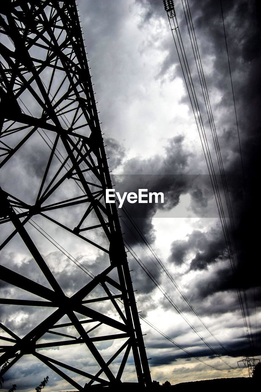 LOW ANGLE VIEW OF ELECTRICITY PYLONS AGAINST SKY