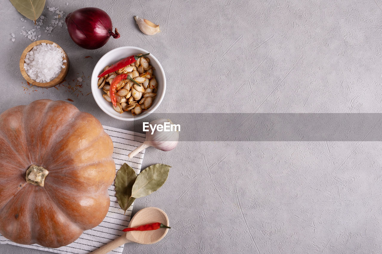 Ripe musk gourd and various spices and ingredients on the kitchen table. healthy food. top view,. 