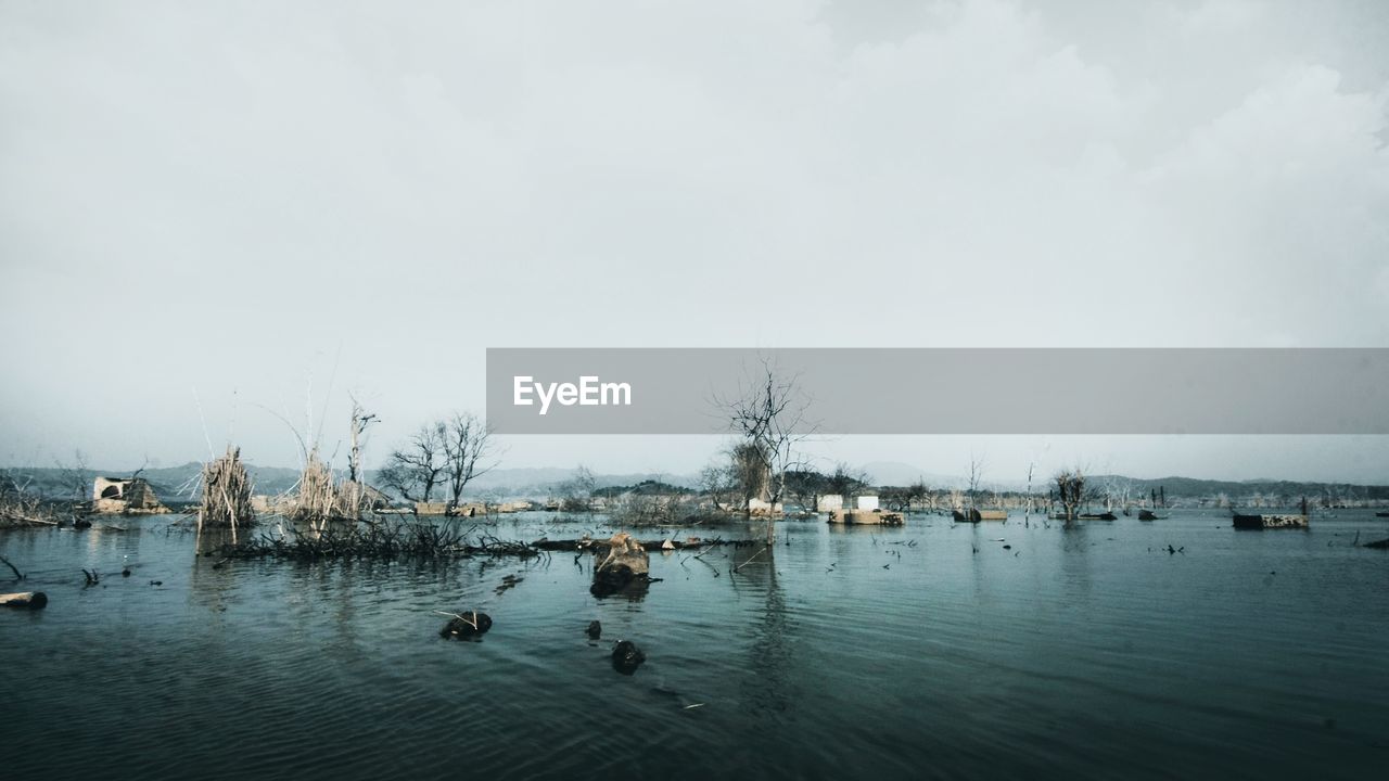 VIEW OF DUCKS SWIMMING IN LAKE