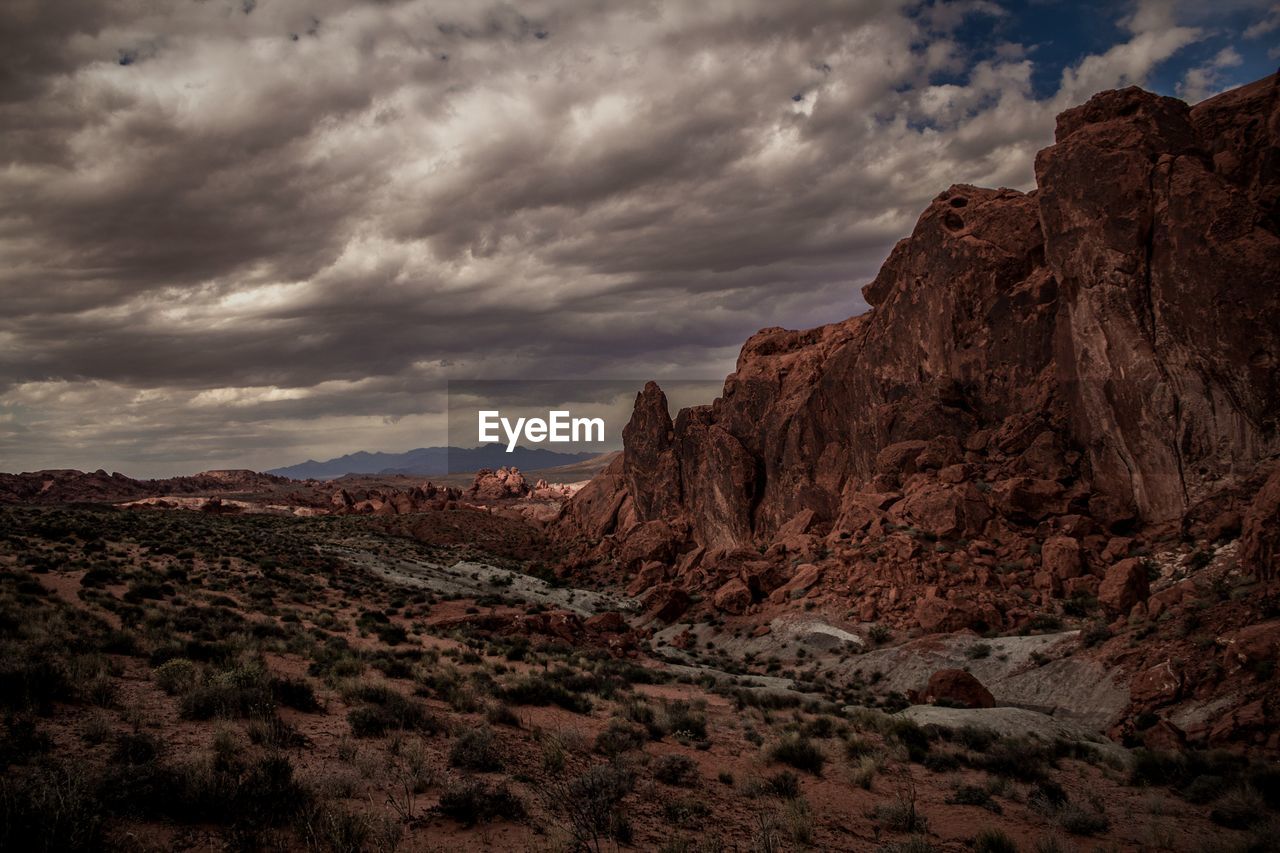 Rock formations on landscape against sky