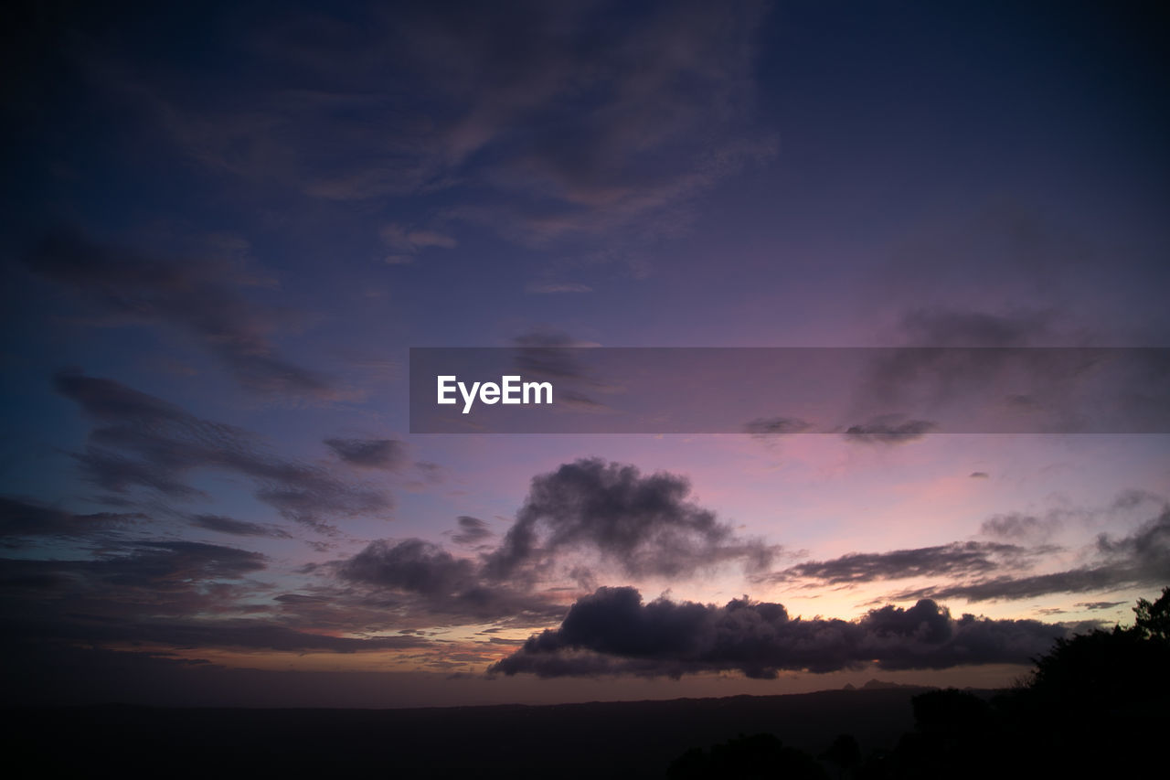 Low angle view of dramatic sky during sunset