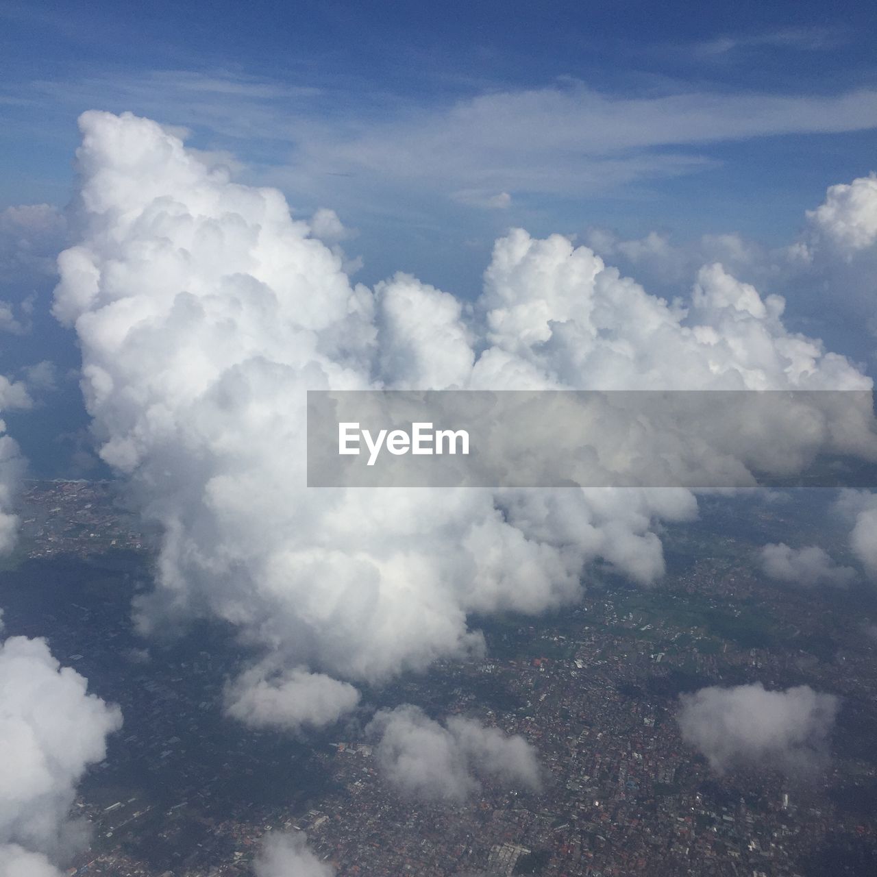AERIAL VIEW OF CLOUDY SKY OVER LANDSCAPE