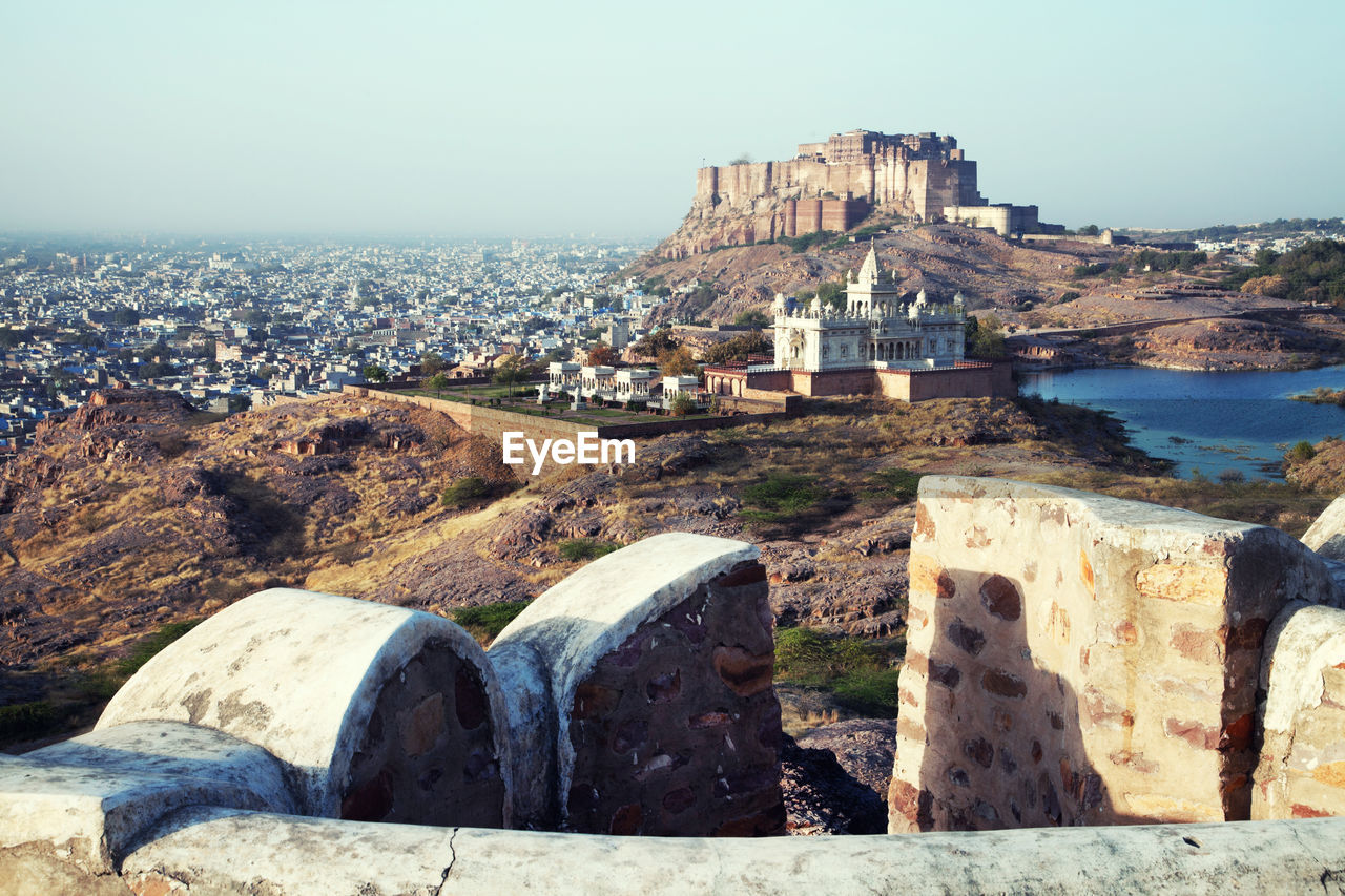 Mid distant view of mehrangarh fort and jaswant thada against clear sky