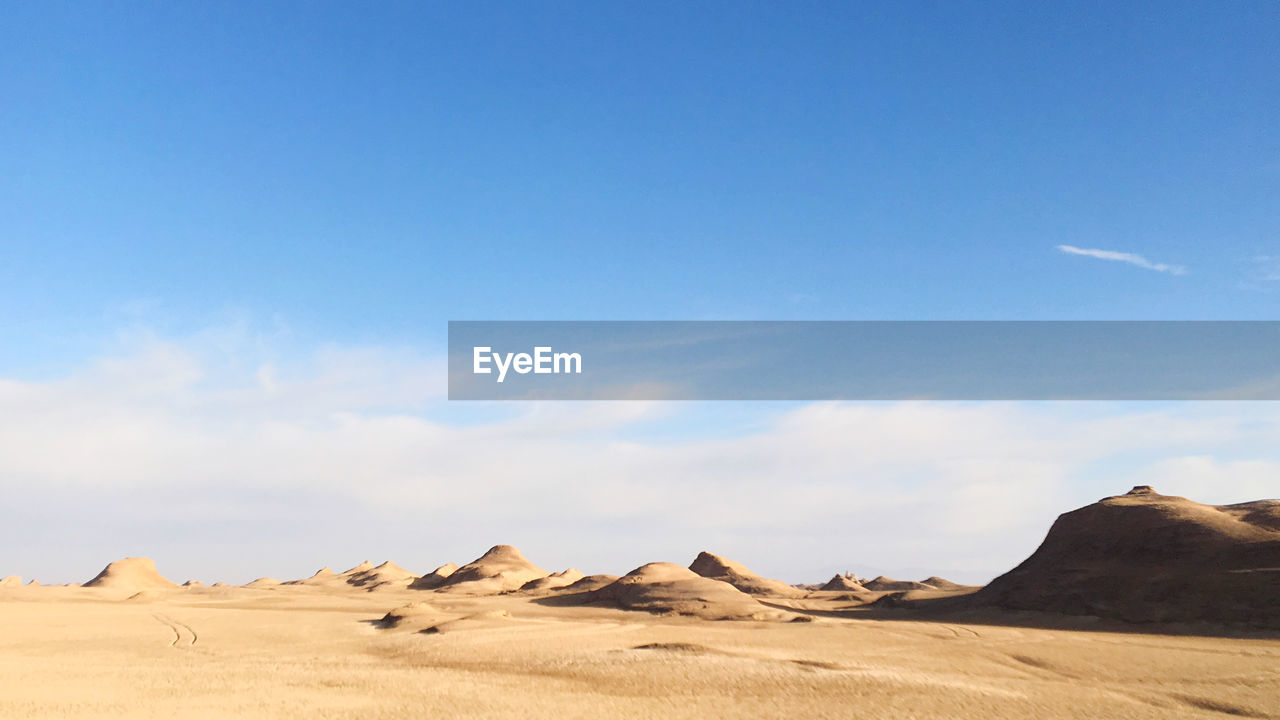 Scenic view of desert against sky