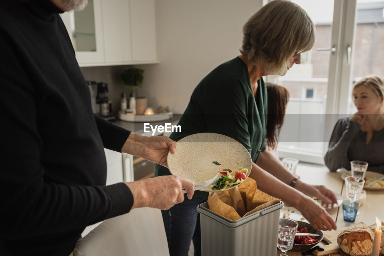 Family cleaning after having dinner