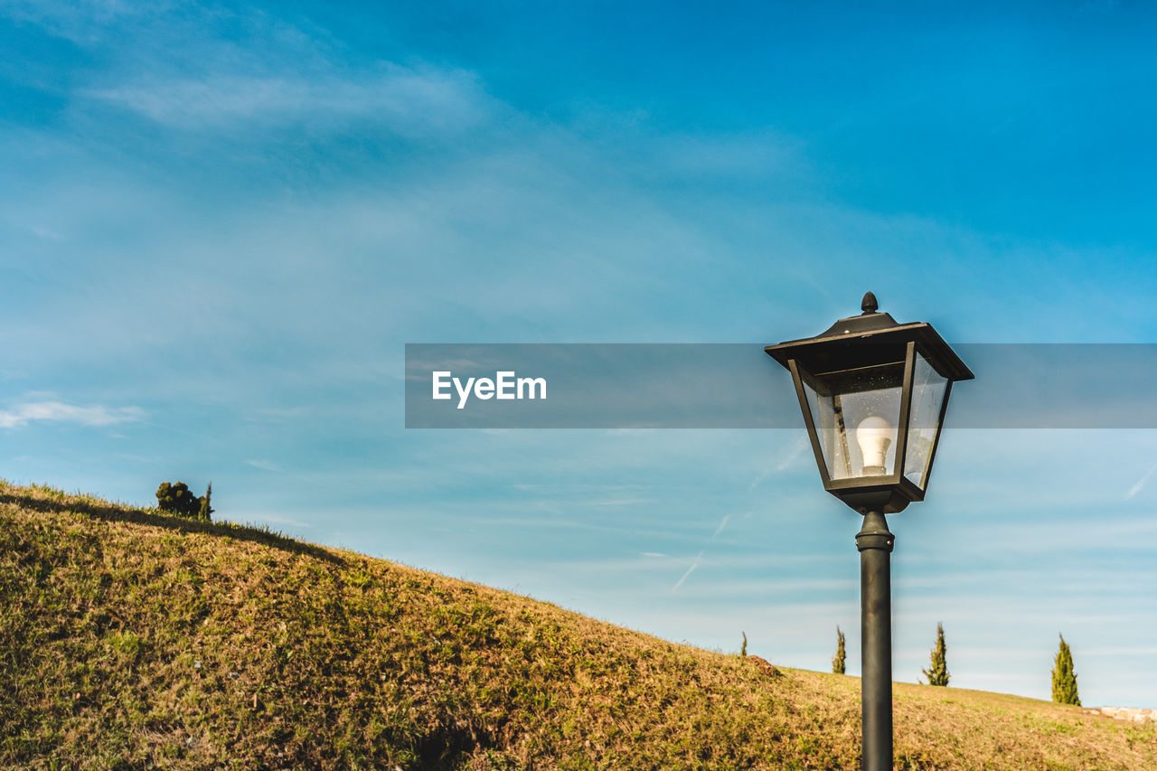 Low angle view of street light against sky