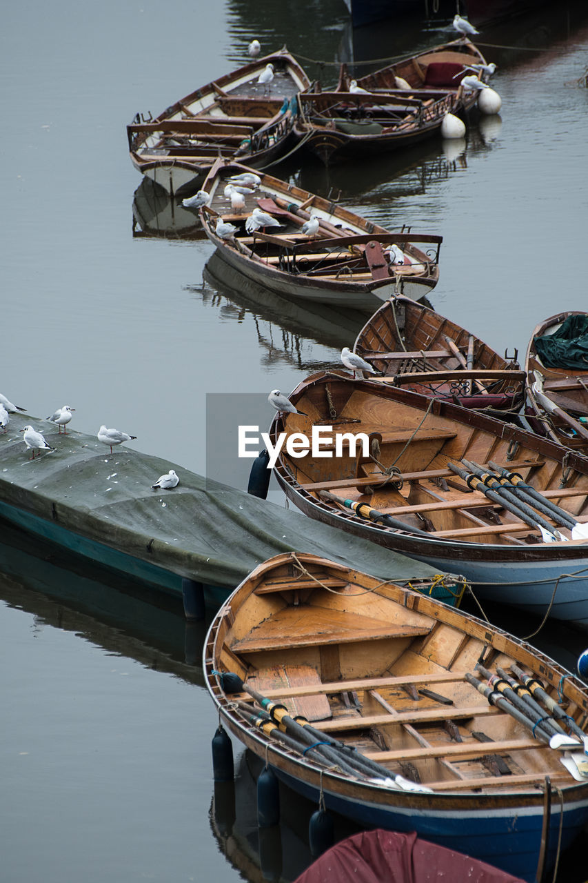 High angle view of boats moored at harbor