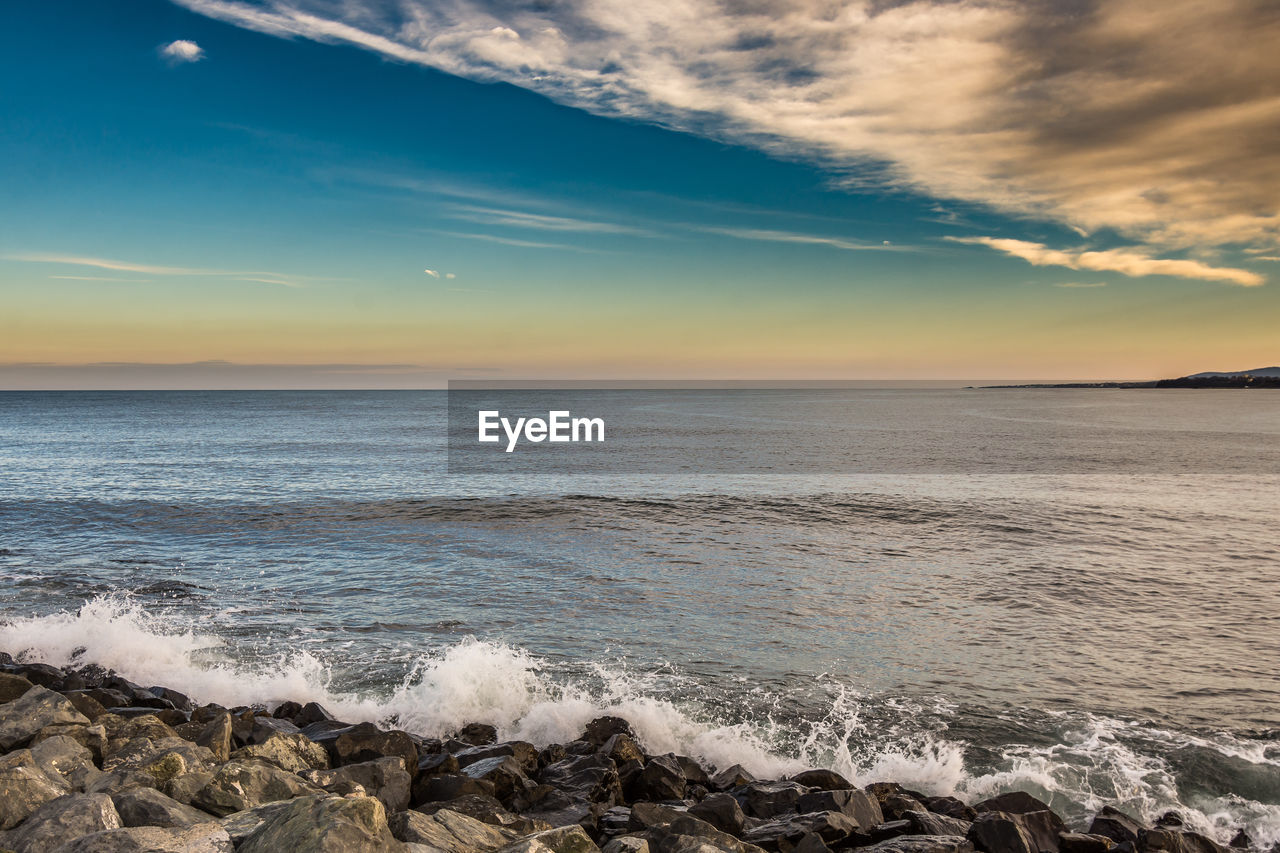 Scenic view of sea against sky during sunset