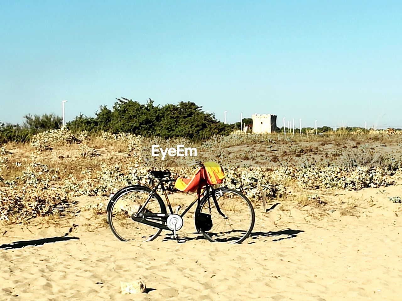 SILHOUETTE OF BICYCLE ON BEACH